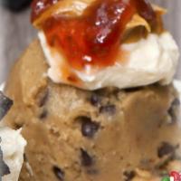 PB&J Cookie Dough Scoop · Chocolate Chip Cookie Dough Scoop with peanut butter frosting topped with strawberry jam.