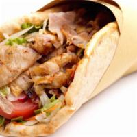 Lamb Gyros · Thinly-sliced lamb, freshly grilled veggies and tzatziki sauce, wrapped in wholesome pita br...