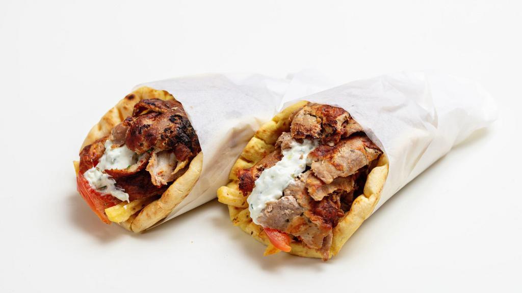 Combo Gyros · Signature combo gyro made with chicken and lamb, freshly grilled veggies and tzatziki sauce, wrapped in wholesome pita bread.