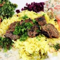Lamb Kabob Plate · Lamb kabobs with mediterranean-styled rice, hummus, Greek salad, warm pita bread and grilled...