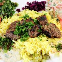 Kefta Kabob Plate · Kefta kabobs with mediterranean-styled rice, hummus, Greek salad, warm pita bread and grille...