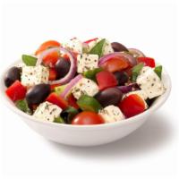 Greek Salad · Fresh salad with pieces of tomatoes, cucumbers, onion, feta cheese and olive oil.