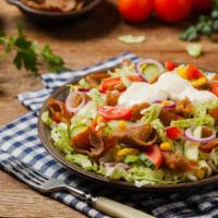 Gyro Salad · Gyro, chopped lettuce, diced red tomatoes, fresh onions and bell peppers.