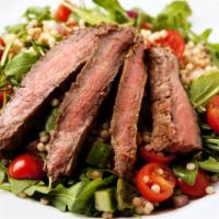 Steak Salad · Steak shawarma, chopped lettuce, diced red tomatoes, fresh onions and bell peppers.