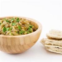 Baba Ghanoush · Savory house-made eggplant dip served with warm pita bread.