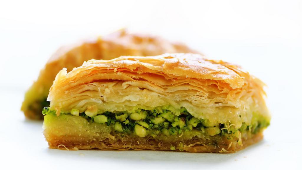 Pistachio Baklava · Traditional filo pastry, stuffed and topped with chopped pistachios and syrup.