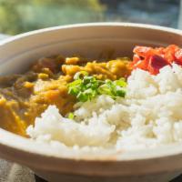 Vegetarian Curry Bowl · Potatoes, carrots, onions, peas cooked in our savory house curry. Served over steamed rice.