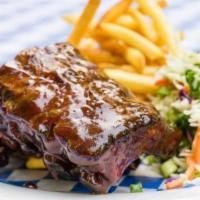 BBQ Baby Back Ribs · Tender babyback ribs with coleslaw and French fries.