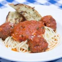 Traditional Spaghetti & Meatballs · Grilled garlic bread.
