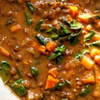 Lentil Soup · Delicately spiced lentil soup garnished with
vegetables