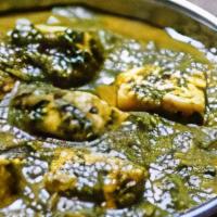 Palak Paneer · Spinach and Indian cheese cooked with spices