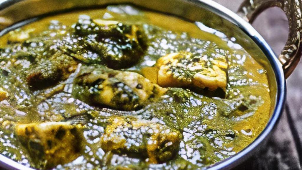 Palak Paneer · Spinach and Indian cheese cooked with spices
