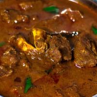 Goat Curry · Goat cooked in traditional sauces and spices