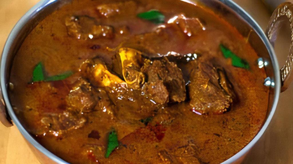 Goat Curry · Goat cooked in traditional sauces and spices