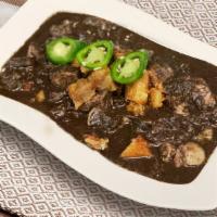 Crispy Dinuguan · The famous pork blood stew with crispy pork belly