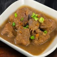 Pork Adobo · Pork braised in soy sauce, garlic and vinegar.  A Filipino comfort food