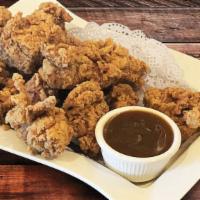 Crispy Fried Chicken · Uniquely spiced fried chicken with our own chicken gravy