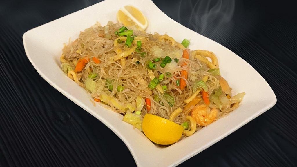 Pancit Bihon · Rice noodles with egg noddles, shrimp, chicken & veggies wok fried in soy sauce and spices