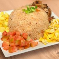Bagoong Fried Rice · Rice fried in shrimp paste with mango cubes, pork bits and shredded eggs on the side
