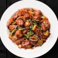 Cauli Manchurian · Crispy fried cauliflower florets are tossed in a spicy sauce with green onions and an Indo-C...
