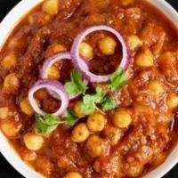 Spiced Chickpea Curry  · Chickpeas cooked with juicy onions, tomatoes, and perfectly grounded spices.