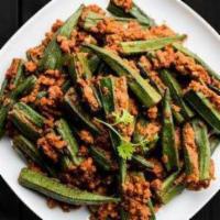 Fried Okra Masala · Okra cooked in a spiced tangy base of onions, tomatoes, and ground spices.