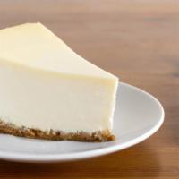 Cheesecake · A creamy, rich new York cheesecake sitting on a graham cracker base.