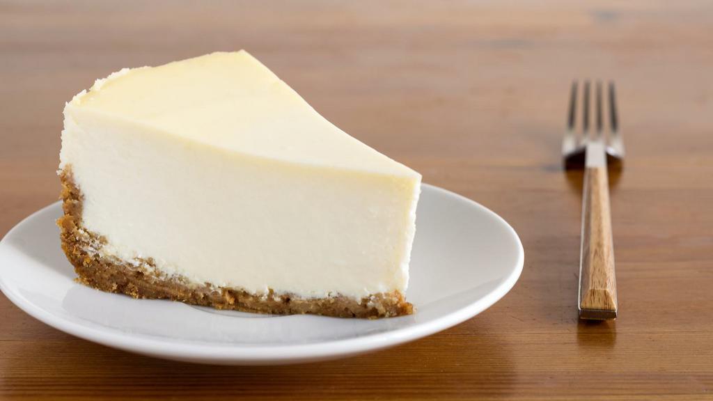 Cheesecake · A creamy, rich new York cheesecake sitting on a graham cracker base.