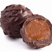 Tartufo Classico(Chocolate Truffle) · Zabaione semifreddo surrounded by chocolate gelato and caramelized hazelnuts, topped with co...