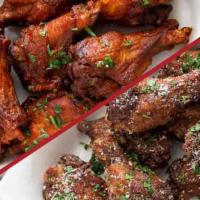 Chicken Wings · Crispy chicken wings tossed with your choice of sauce and served with bleu cheese or ranch d...