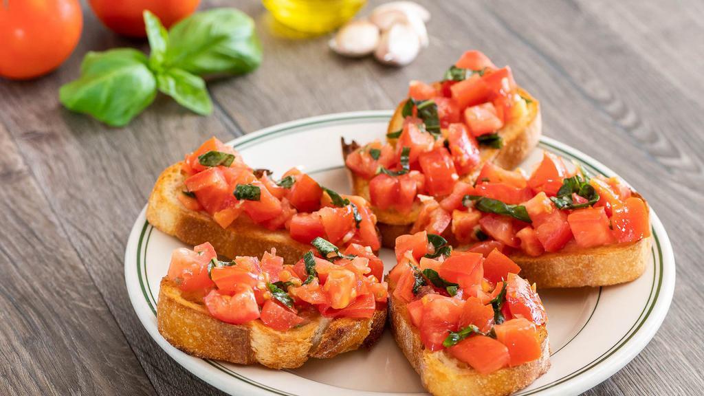 Bruschetta · Toasted sourdough topped with diced fresh tomatoes, garlic, basil and olive oil