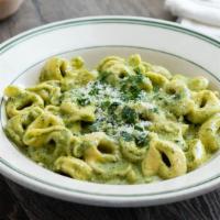 Tortellini alla Mary · Pasta stuffed with beef, ham, and prosciutto, smothered with your choice of creamy pesto or ...
