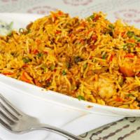 Himalayan Briyani · A mix of chicken, lamb, fish, and shrimp and basmati rice fried with onion and peas with som...