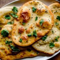 Garlic Naan · Traditional naan with garlic and butter.