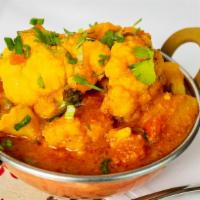 Aloo Gobi · Vegan. Fresh cauliflower and potatoes cooked in our special homestyle herb spices.