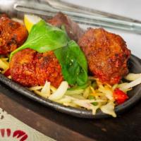 Lamb Boti Kebab · Chunks of boneless lamb marinated with yogurt and a house blend of spices.cooked in a clay o...