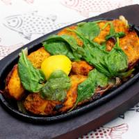 Fish Tandoori · Salmon marinated in a house blend of spices.and cooked in a clay oven