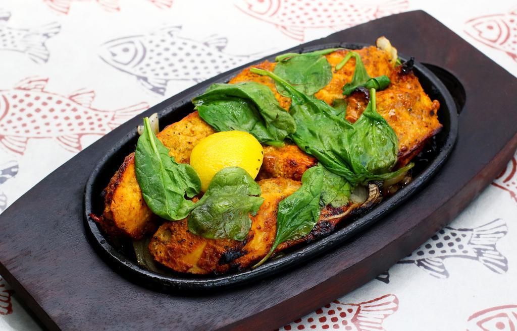 Fish Tandoori · Salmon marinated in a house blend of spices.and cooked in a clay oven
