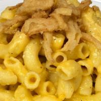 Mac N Cheese · All Natural Homemade with a savory Bechamel sauce tossed in mild Cheddar Cheese.
