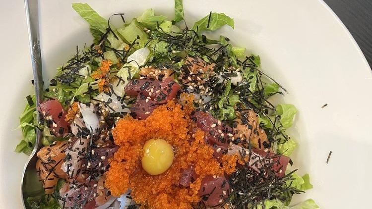 Spicy Deluxe Chirashi · Spicy. assorted sashimi, vegetables, quail egg yolk, tobiko over rice w/ sweet & spicy sauce.