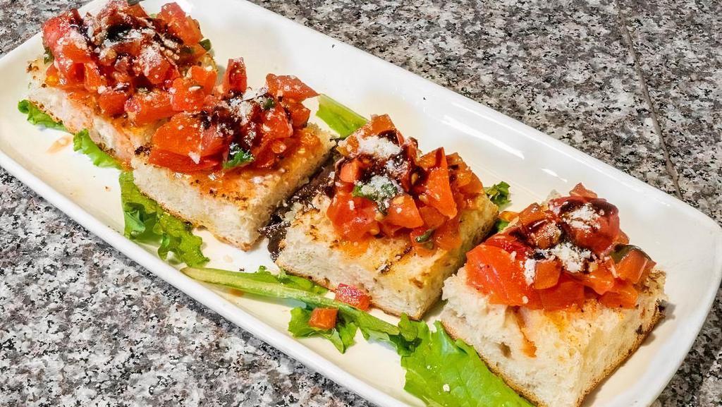 Bruschetta · Fresh diced tomatoes with garlic, extra virgin olive oil & basil served over toasted Italian bread