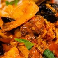 Cioppino (D) · Clams, mussels, Calamari, fish, prawns, crab, Linguini pasta, with marinara sauce