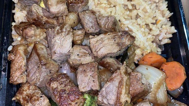 Filet Mignon · Filet mignon served with vegetables and rice.