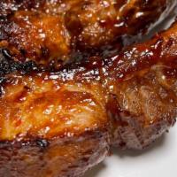 BABY BACK RIBS BBQ QUARTER SLAB · Quarter slab BABY BACK RIBS (3 ribs served sliced ), GRILLED WITH OUR OWN RECIPE OF BBQ SAUC...