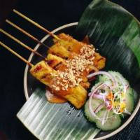 Chicken Satay · Grilled chicken breast marinated with Thai curry powder dressed with peanut sauce, and serve...