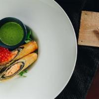 Salmon Rolls · Seaweed wrapped marinated salmon (medium-done) in fried spring rolls topped with ikura. Side...