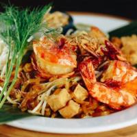Pad Thai · Stir-fried noodles with eggs, bean sprouts, chives, tofu, crushed peanuts, and your choice o...