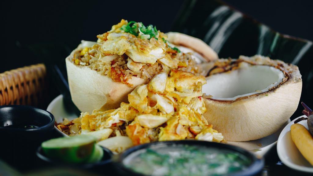 Crab Fried Rice · Fried rice with crab, green onions, white onions and double eggs served in young coconut with vegetable broth. Prik nam pla.