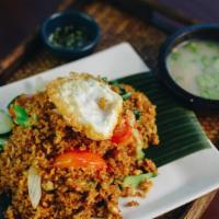 Cal-Train Fried Rice · Thai traditional country fried rice with egg, ground chicken, tomatoes, Asian broccoli, whit...