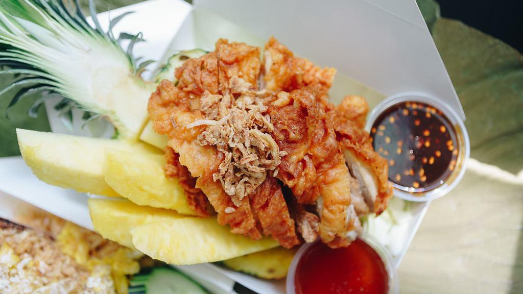 Aloha Fried Chicken · Fried Chicken topped with fired shallots served with fresh pineapple meat  in pineapple. Comes with sweet&sour sauce, north-eastern style sauce, and sticky rice.